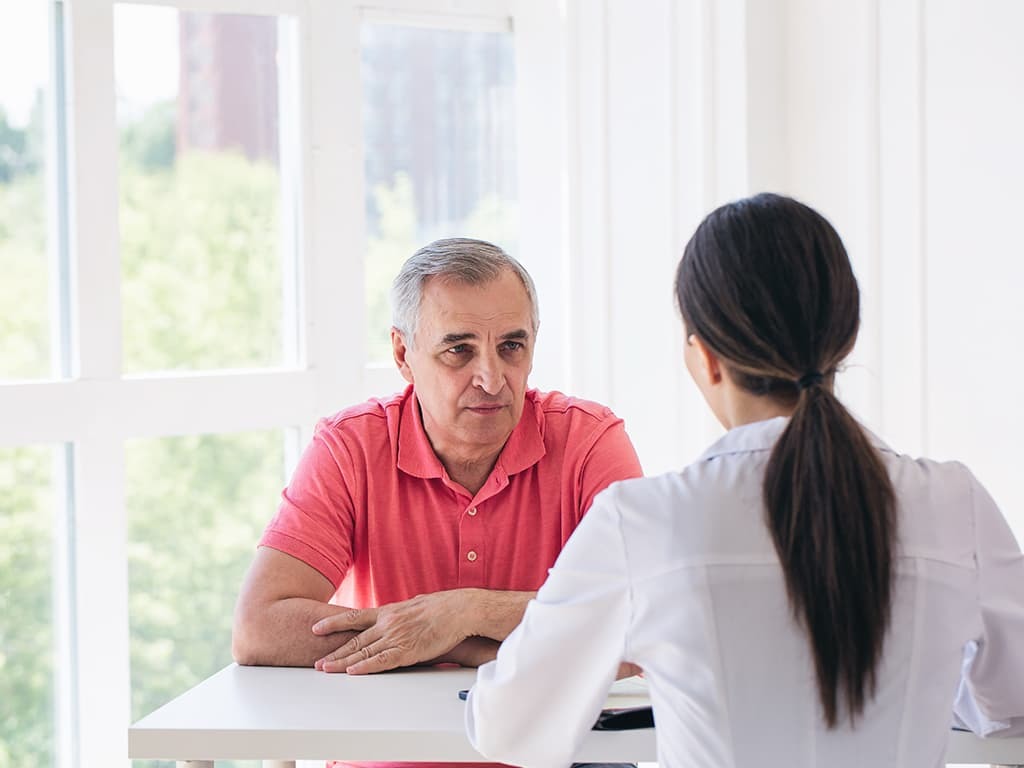 ALS patient working with speech therapist