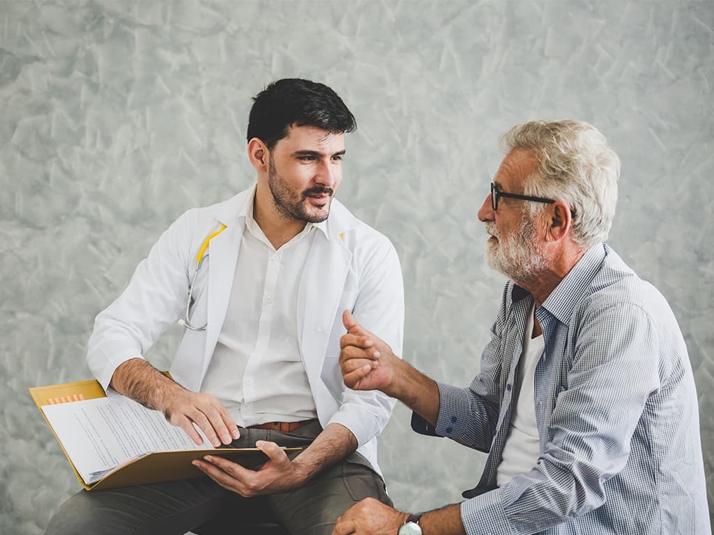 ALS patient working with a speech therapist