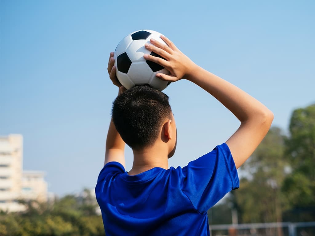Boy playing football