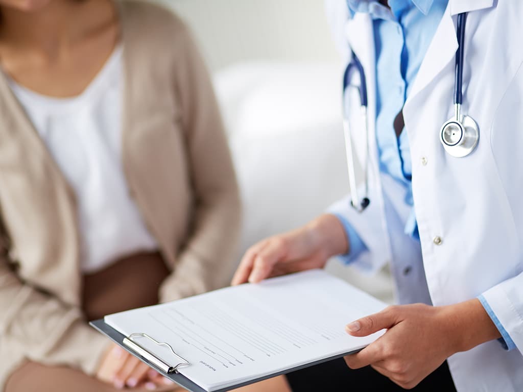 Doctor looking at ALS Functional Rating Scale results